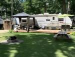 Parked RV with patio at site Sun Retreats Amherstburg - thumbnail