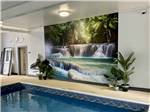 View larger image of A mural next to the indoor swimming pool at BEECH HILL CAMPGROUND  CABINS image #2