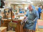 View larger image of A man in the woodworking shop at PARK PLACE ESTATES image #2