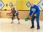 View larger image of A woman and man playing pickleball at PARK PLACE ESTATES image #9