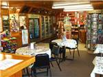 Interior of gift shop with dining tables at BROWN'S TOWN CAMPGROUND - thumbnail