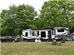 A fifth wheel trailer in a campsite at GLENVIEW COTTAGES & RV PARK - thumbnail