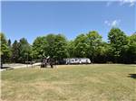 Playground, grassy area and travel trailer at GLENVIEW COTTAGES & RV PARK - thumbnail