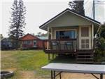 A row of colorful rental cottages at SEAVIEW CAMPGROUND & COTTAGES - thumbnail