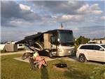 Pair of campers near motorhome at HEIDI'S CAMPGROUND - thumbnail