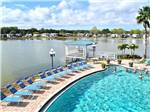 View larger image of Aerial view over water and swimming pool at WINTER QUARTERS MANATEE RV RESORT image #2