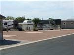 View larger image of Big rigs parked in gravel sites at ARIZONIAN RV RESORT image #2