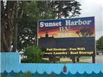 View larger image of The front entrance sign at SUNSET HARBOR RV PARK image #2