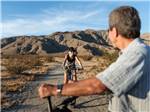 A man and woman mountain biking - thumbnail