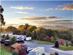 View larger image of View of park and hills at sunset at ASHEVILLE BEAR CREEK RV PARK image #1