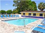 View larger image of Swimming pool with outdoor seating at WINTER QUARTERS PASCO RV RESORT image #2