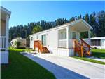 View larger image of Small white buildings with wood stairs  at WINTER QUARTERS PASCO RV RESORT image #5