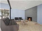 View larger image of A sitting area looking at the fireplace at WATERFRONT RV PARK image #8