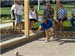 View larger image of Lady playing bocce ball at WESTWIND RV  GOLF RESORT image #5