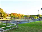 View larger image of Picnic tables and tennis courts at ARROWHEAD RESORT CAMPGROUND image #4