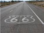 View larger image of Route 66 painted on a street nearby at DESERT WILLOW RV RESORT image #3