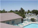 View larger image of An aerial view of the swimming pool at DESERT WILLOW RV RESORT image #11