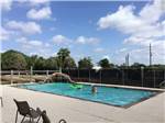 People in the swimming pool at HOUSTON WEST RV PARK - thumbnail