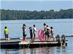 Kids standing on the dock at BEYONDER GETAWAY AT WHEELER LAKE - thumbnail
