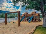 The children's playground with a swing set at SWAN VALLEY RV PARK - thumbnail