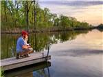 A man and his daughter fishing at CAMELOT CAMPGROUND QUAD CITIES - thumbnail