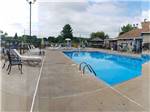 A view of the fenced in swimming pool at CAMELOT CAMPGROUND QUAD CITIES - thumbnail