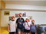 Four kids wearing pirate paper mask at CAMELOT CAMPGROUND QUAD CITIES - thumbnail
