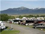 View larger image of Snowcapped mountains and RVs camping at INDIAN CREEK RV PARK  CAMPGROUND image #1