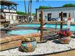 View larger image of The pool and hot tub area at WINTER RANCH RV RESORT image #7