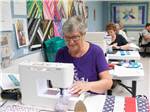 View larger image of A group of women making quilts at WINTER RANCH RV RESORT image #8