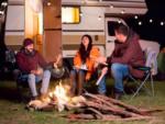 People sitting by a campfire - thumbnail