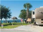 View larger image of A fifth-wheel trailer parked in a site overlooking the Gulf of Mexico at EMERALD BEACH RV PARK image #5