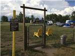 The dog park with a couple of yellow chairs at FALCON MEADOW RV CAMPGROUND - thumbnail