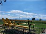 A yellow picnic bench at FALCON MEADOW RV CAMPGROUND - thumbnail