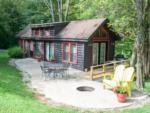 A cabin rental surrounded by trees at RENFRO VALLEY KOA HOLIDAY - thumbnail