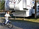 A kid riding his bike at HIGH SIERRA RV & MOBILE PARK - thumbnail