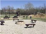 A fire pit area with seating at COWTOWN RV PARK - thumbnail