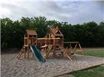 The wooden playground equipment at COWTOWN RV PARK - thumbnail