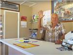 Man waving from behind the counter at Valley View RV Park - thumbnail