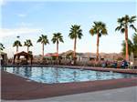 Swimming pool with outdoor seating at FORTUNA DE ORO RV RESORT - thumbnail
