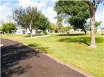 View larger image of An empty paved RV site at FIG TREE RV RESORT image #11