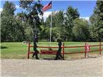 An American flag in a graasy area at BLACK RABBIT RV PARK - thumbnail