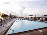 View larger image of Swimming pool with outdoor seating at HILTON HEAD HARBOR RV RESORT  MARINA image #5