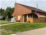 Exterior of the office with an American flag at Lebanon Hills Campground - thumbnail