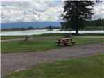 View larger image of A picnic bench next to a gravel site at SPRUCE PARK ON THE RIVER image #4