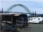 View larger image of Arched suspension bridge behind RV at PORT OF NEWPORT MARINA  RV PARK image #5