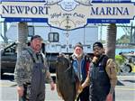 Fishermen showing off their catch-of-the-day - thumbnail