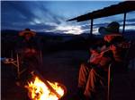 Playing music by the fire - thumbnail