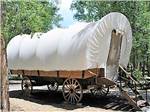 A conestoga wagon rental at DOLORES RIVER RV RESORT BY RJOURNEY - thumbnail