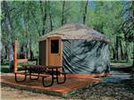 A yurt rental with a picnic bench at DOLORES RIVER RV RESORT BY RJOURNEY - thumbnail